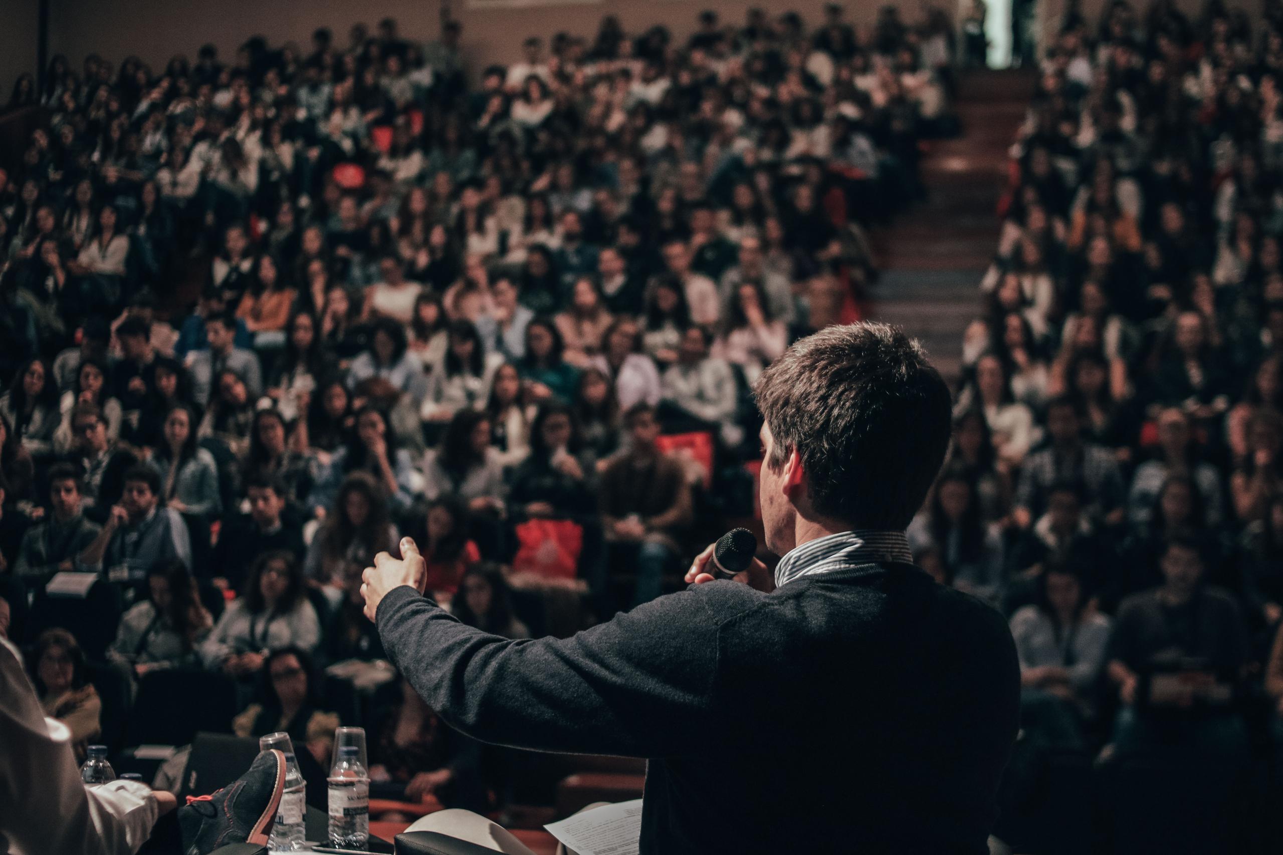 Speaker facing group of people at the award ceremony
