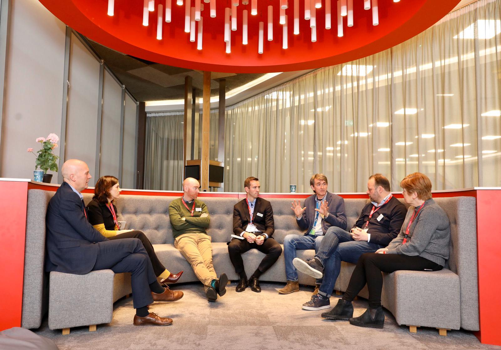 common purpose_group of people sitting in semicircular sofa_tania